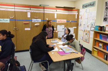 Instructor Blanca Claudio (standing) teaches a history lesson in Spanish in a Dual Language Academy class at Franklin High School in Los Angeles, California.