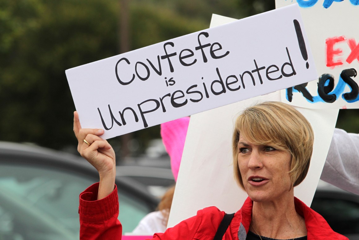 Demonstrator Annette Lievers carries a sign concerning a recent Donald Trump tweet as she joined about 200 demonstrators before a town hall meeting with Republican Representative Darrell Issa at a high school in San Juan Capistrano, California, on June 3rd, 2017.