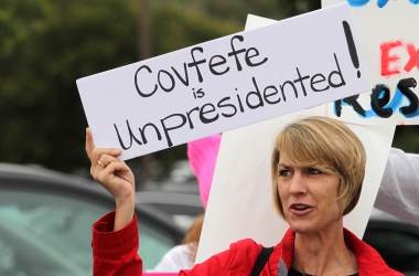 Demonstrator Annette Lievers carries a sign concerning a recent Donald Trump tweet as she joined about 200 demonstrators before a town hall meeting with Republican Representative Darrell Issa at a high school in San Juan Capistrano, California, on June 3rd, 2017.