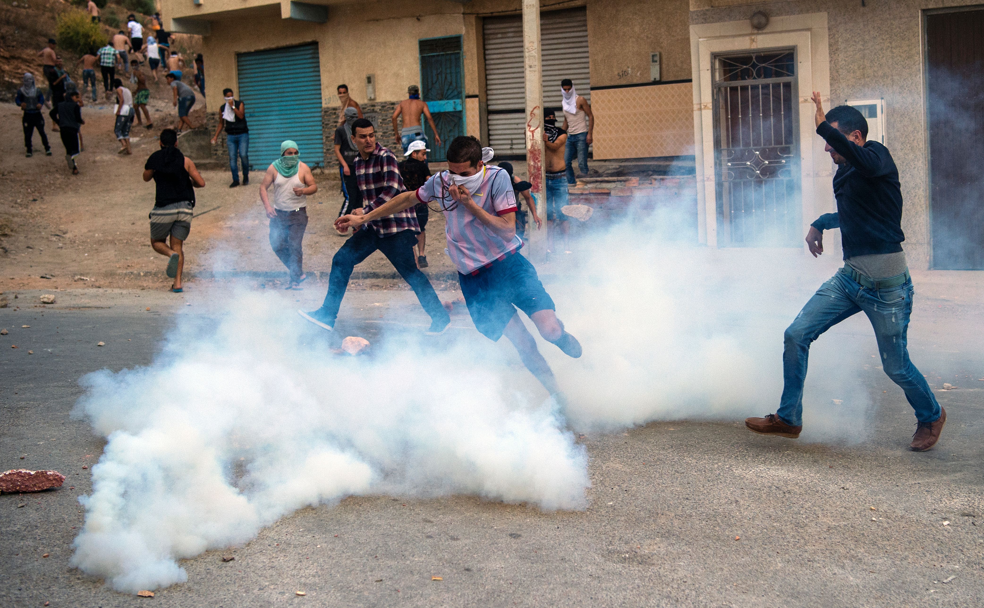 Tear gas from security forces surrounds protesters from the Rif movement during clashes in Hoceima on June 8th, 2017.