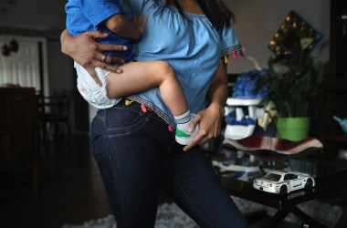 An undocumented immigrant from Peru holds her son at their home on June 6th, 2017, in Thornton, Colorado.