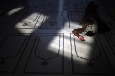 A Pakistani Muslim rests at a mosque during the holy month of Ramadan in Karachi on June 9th, 2017.