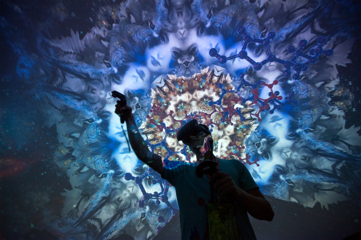 A man tries out a virtual reality game inside a Fulldome.pro 360-degree projection dome on opening day of the Electronic Entertainment Expo at the Los Angeles Convention Center on June 13th, 2017.