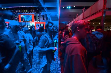 Gaming fans step from the Playstation blue into the Nintendo red display rooms on day one of E3 2017, the three-day Electronic Entertainment Expo, one of the biggest events in the gaming industry calendar, on June 13th, 2017 in Los Angeles, California.