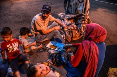 A family breaks their Ramadan fasting on June 16th, 2017, in Diyarbakir, Syria.