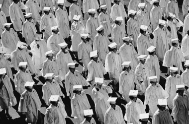 A black and white image of graduates in their robes.