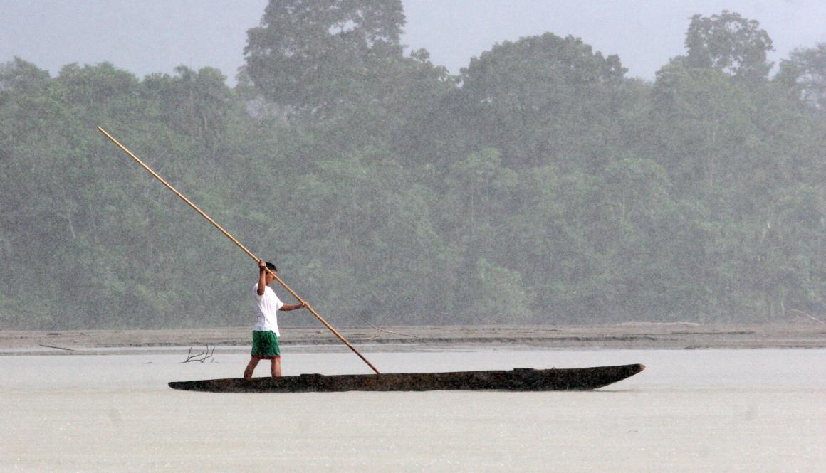 An indigenous man navagates along the Napo River as it runs through the Yasuni National Park in the Ecuadorean Amazon region, 300 km east of Quito, on May 16th, 2007.