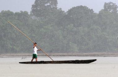 An indigenous man navagates along the Napo River as it runs through the Yasuni National Park in the Ecuadorean Amazon region, 300 km east of Quito, on May 16th, 2007.