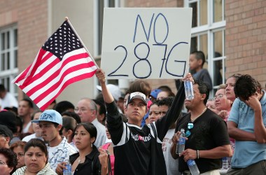 Demonstrators opposing proposition 287(g) gather on July 16th, 2007, in Waukegan, Illinois.