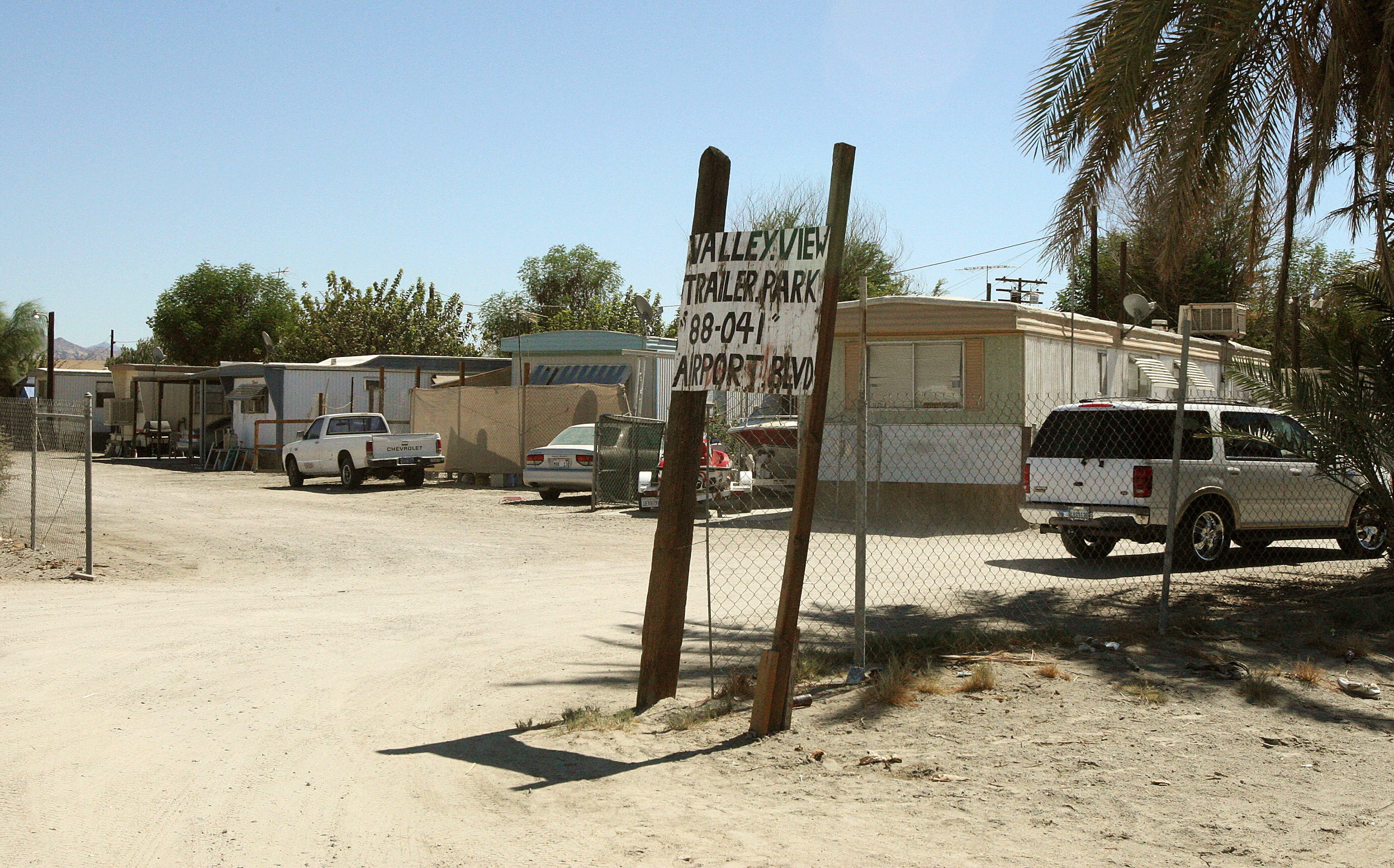 One of the many trailer parks catering to undocumented workers in Thermal, California, an hour and 30 minute drive to the Mexican border. Thermal and the surrounding unincorporated towns share the Coachella Valley with the world-class golf resorts and private clubs of Palm Springs less than 30 miles away.