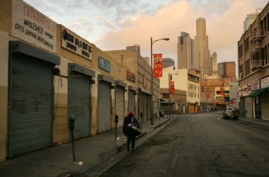 A homeless man walks down the street in the downtown Skid Row area of Los Angeles, California.