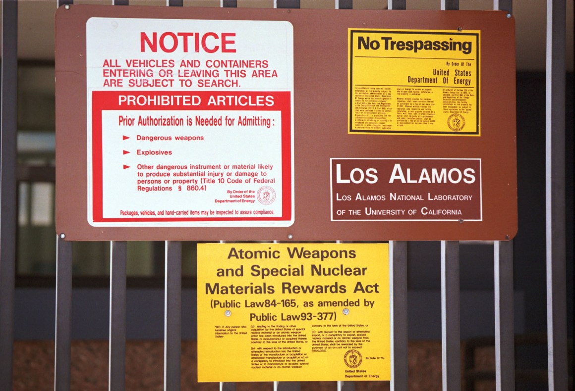 Signs are posted on the gated wall around the main technical area of Los Alamos National Laboratory in New Mexico.