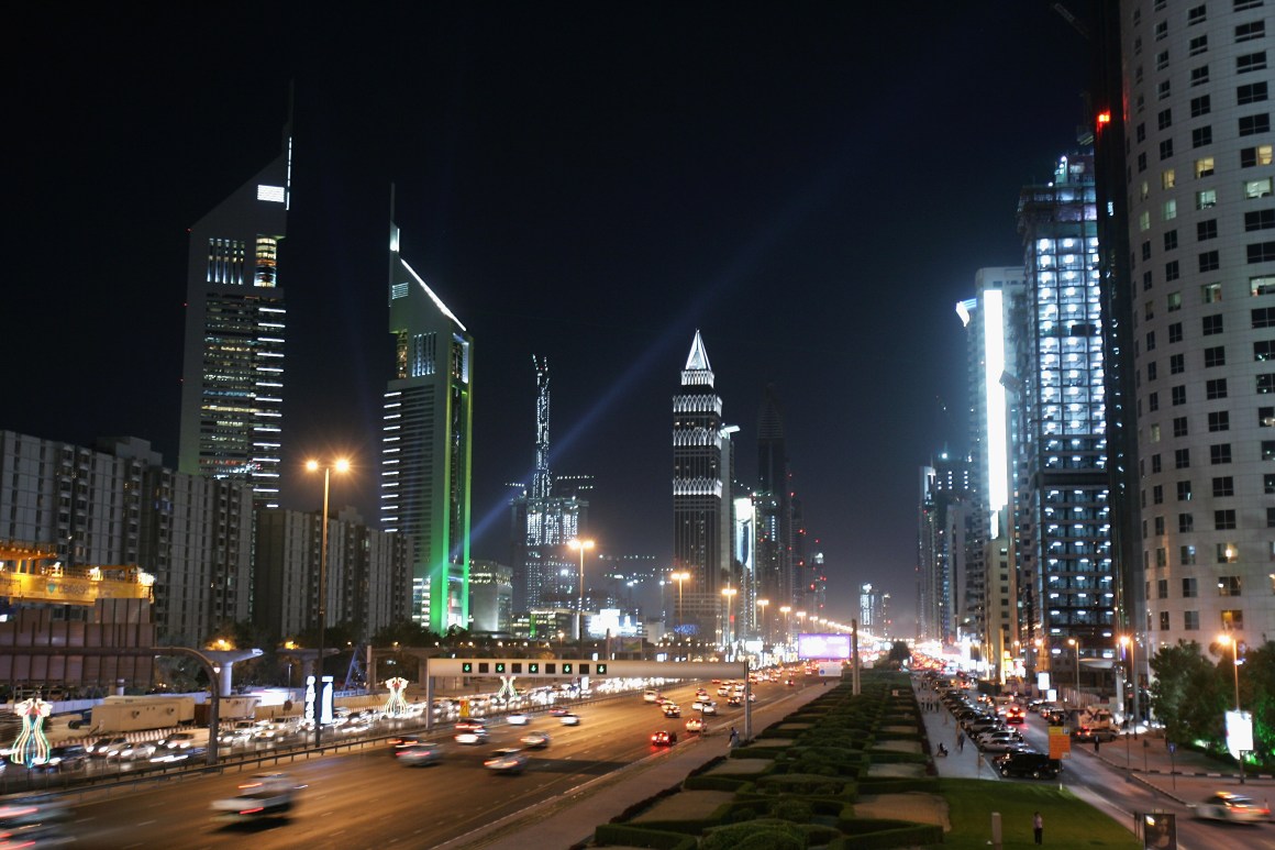 The iconic Emirates Towers dominate the skyline beside the wide boulevard of Sheikh Zayed Road on December 3rd, 2007, in Dubai, United Arab Emirates.