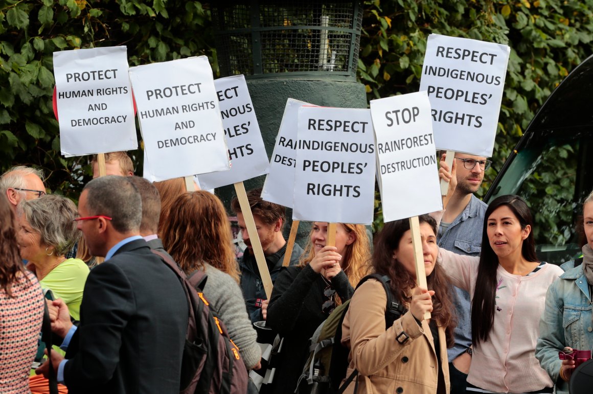 Demonstrators hold banners during a meeting of Norwegian Prime Minister Erna Solberg with Brazilian President Michel Temer in Oslo on June 23rd, 2017.