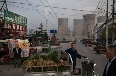 Chinese street vendors at a market outside a state-owned coal-fired power plant near the site of a large floating solar farm construction project on June 14th, 2017, in Huainan, Anhui province, China.