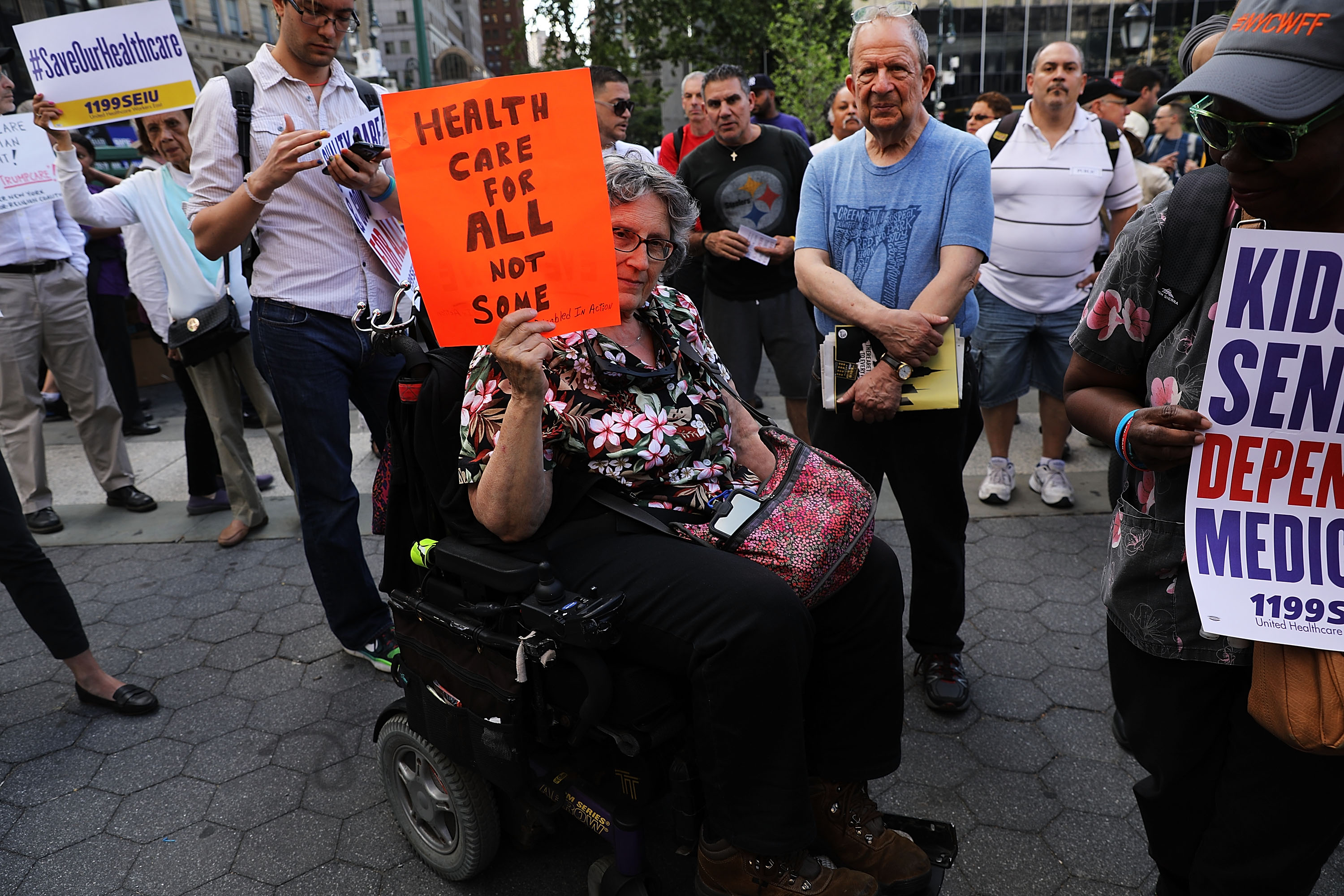 Jean Ryan from Disabled in Action joins others in protesting against the Senate health-care bill in New York City on June 28th, 2017.