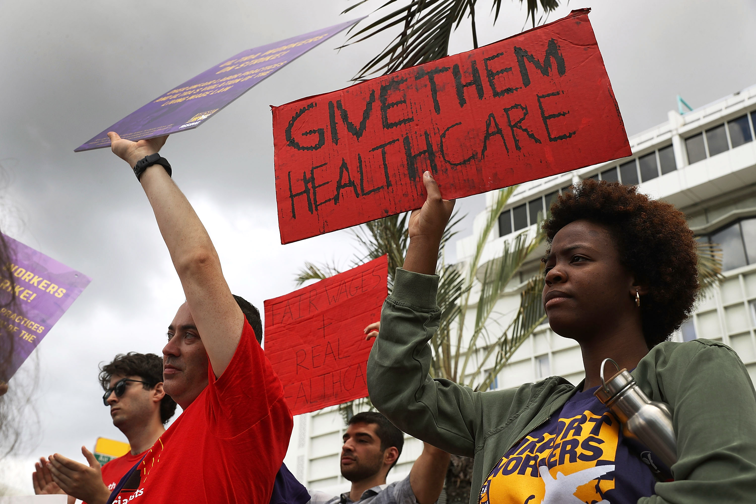 Danielle Robinson (right) joins with union representatives and supporters of the striking Ultra Aviation workers at Miami International Airport on June 29th, 2017.