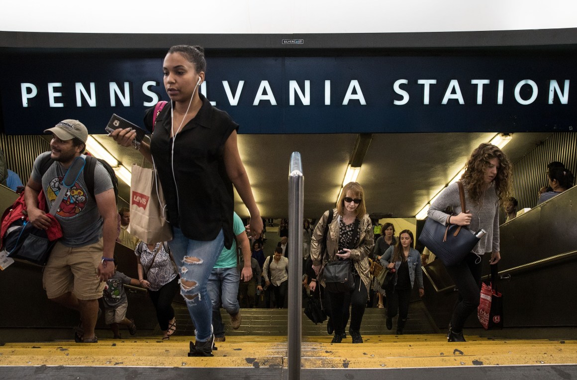 Commuters exit Penn Station during the morning rush hour on July 7th, 2017, in New York City.