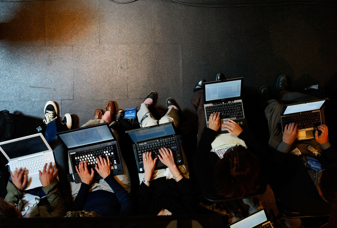 Reporters work on their laptops in Beaverton, Oregon.