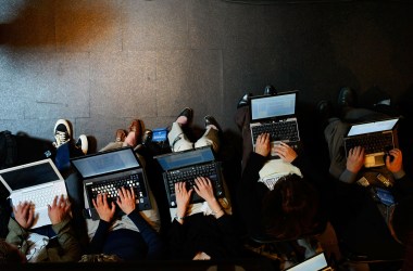 Reporters work on their laptops in Beaverton, Oregon.