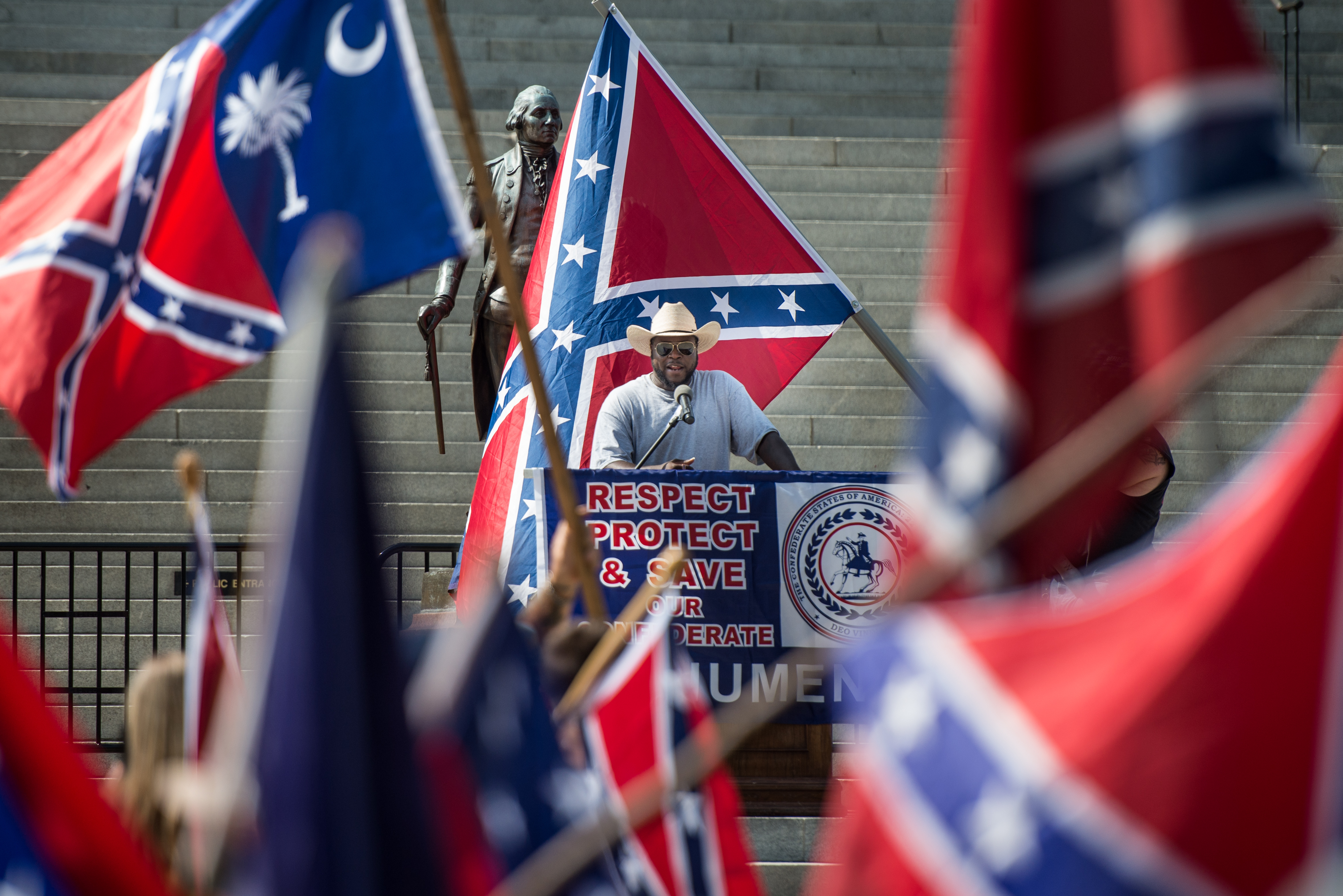 BC Johnson talks to demonstrators at the South Carolina Statehouse on July 10th, 2017, in Columbia, South Carolina. To mark the two-year anniversary of the removal of the Confederate flag from statehouse grounds, demonstrators gathered to fly a replica for several hours at its former location.