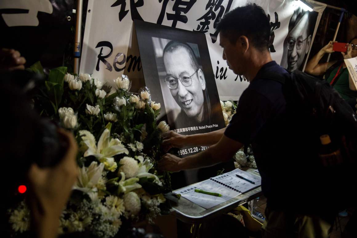 Protesters pay their respects outside the Chinese Liason Office of Hong Kong after the death of Chinese Noble laureate Liu Xiaobo, in Hong Kong on July 13th, 2017. The United States called on China to free the dissident's widow from house arrest and let her leave the country.