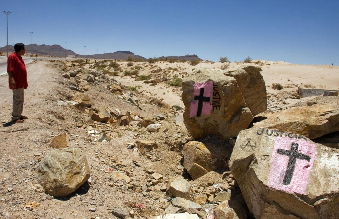 A man looks at rocks painted with crosses calling for justice, in allusion to deaths resulting from drug cartels' struggle for control in Ciudad Juarez, Mexico, on May 28th, 2008.