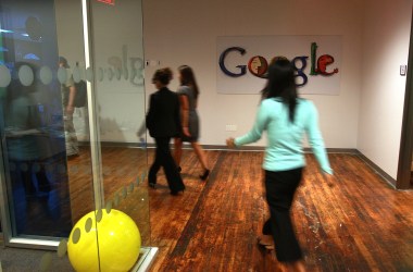 Employees of Google walk down a hallway at the New York office in 2008.