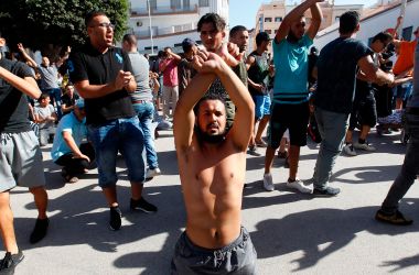 Demonstrators gesture and shout slogans in front of Moroccan security forces during a march in defiance of a government ban in the northern Moroccan city of Hoceima on July 20th, 2017.