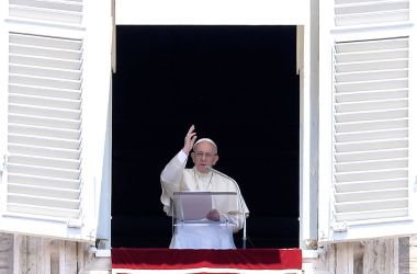 Pope Francis blesses the crowd attending the Angelus prayer in St. Peter's Square at the Vatican on July 23rd, 2017.