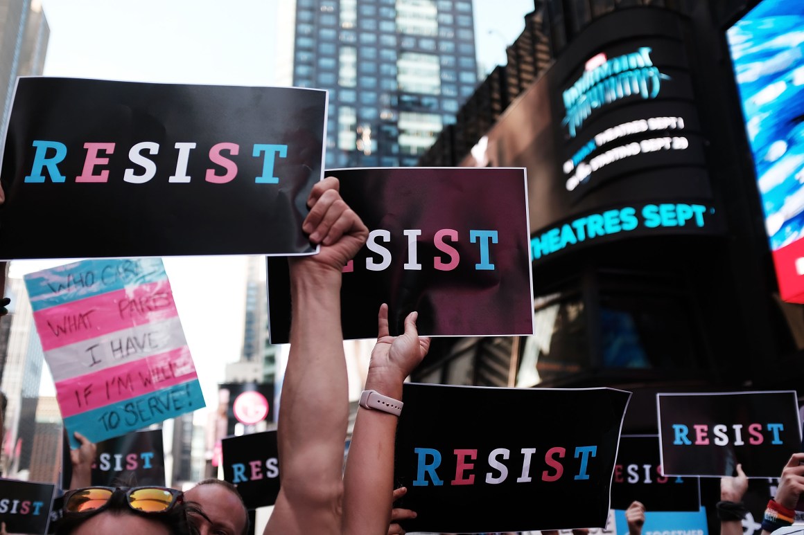 Protesters gather in Times Square near a military recruitment center to show their anger at President Donald Trump's decision to reinstate a ban on transgender individuals from serving in the military on July 26th, 2017, in New York City.