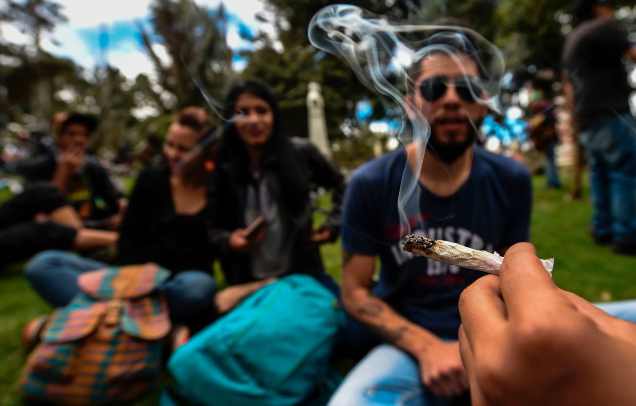 Activists smoke joints during a protest under the motto 