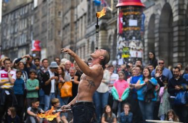 Edinburgh Festival Fringe entertainers perform on the Royal Mile on August 7th, 2017, in Edinburgh, Scotland. This year marks the 70th anniversary of the largest performing arts festival in the world, with an excess of 30,000 performances of more than 2,000 shows.