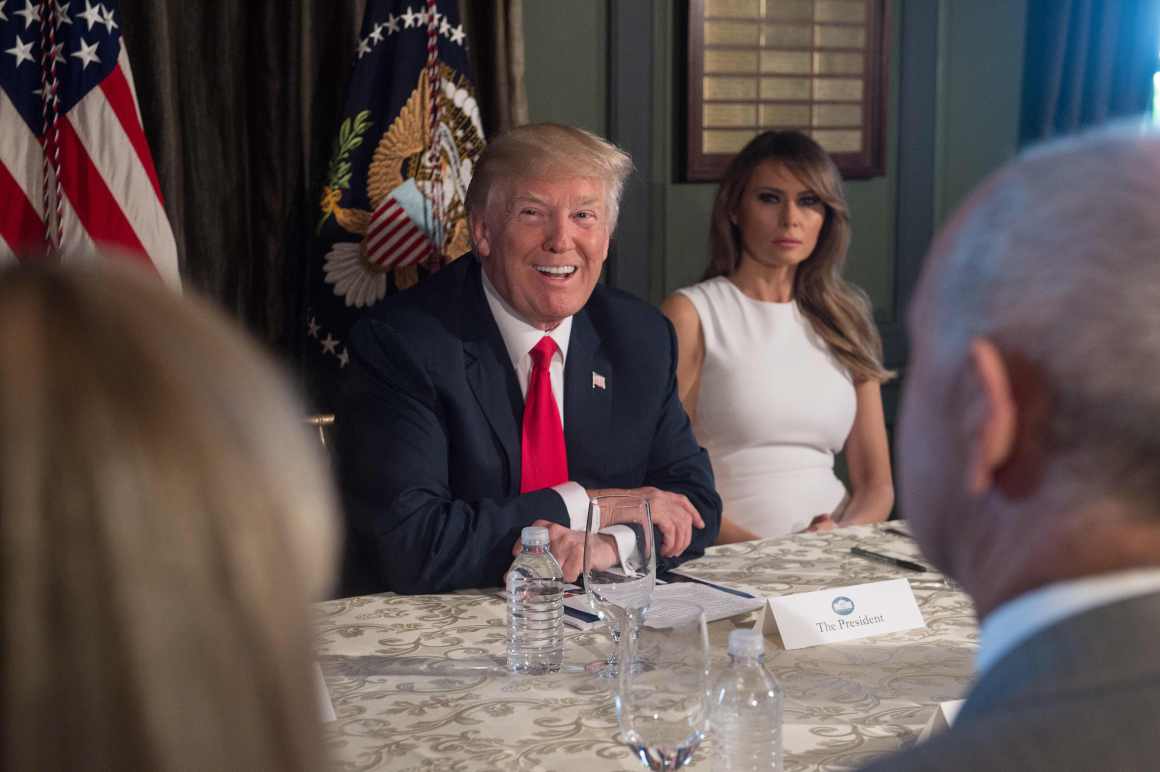 President Donald Trump smiles before a meeting with administration officials and First Lady Melania Trump on the opioid addiction crisis at the Trump National Golf Club in Bedminster, New Jersey, on August 8th, 2017.