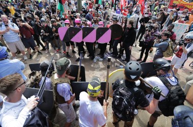 White nationalists, neo-Nazis, and members of the alt-right face anti-fascist counter-protesters at the entrance to Emancipation Park during the "Unite the Right" rally August 12th, 2017, in Charlottesville, Virginia.