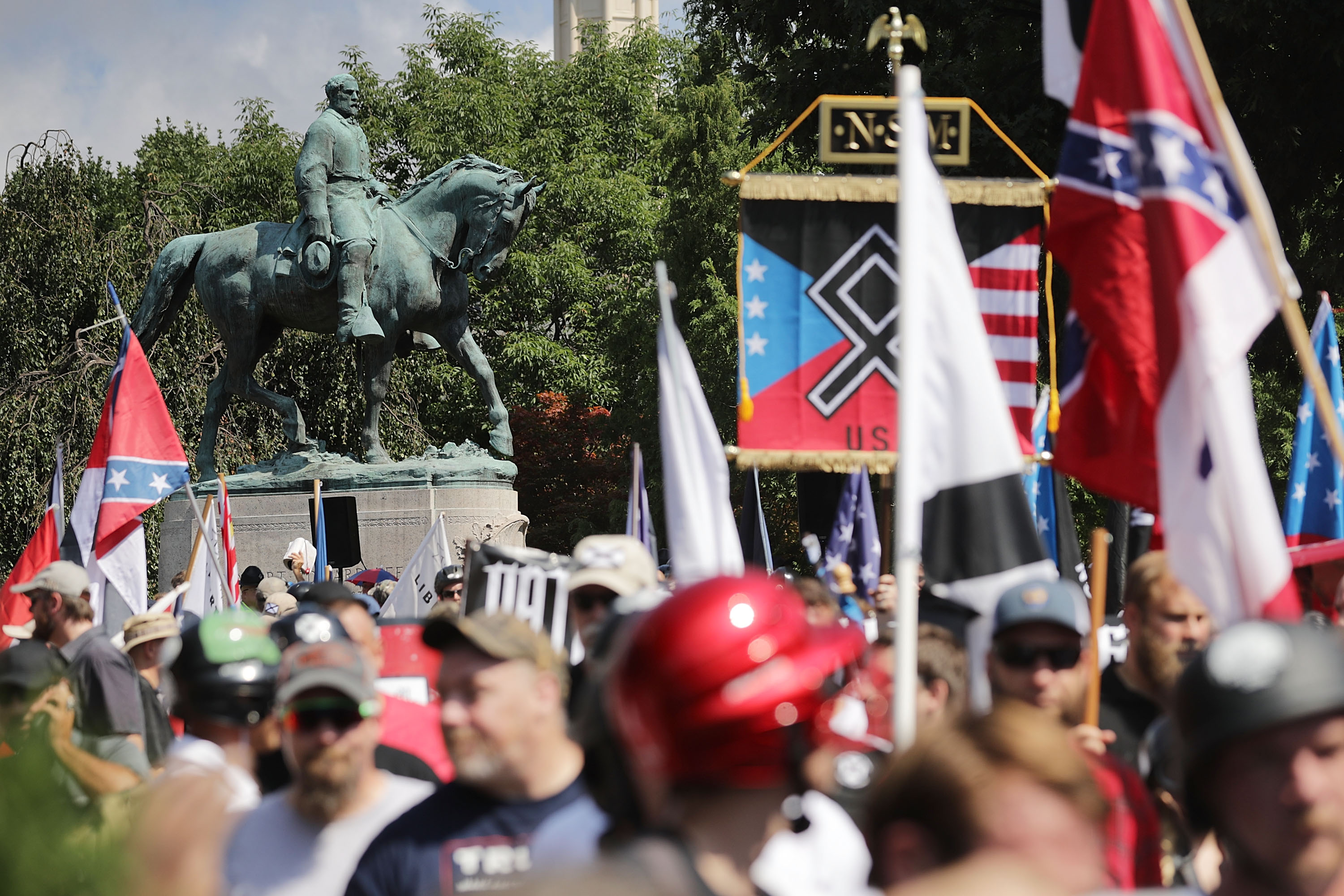 The statue of Robert E. Lee stands behind a crowd of hundreds of white nationalists, neo-Nazis, and members of the alt-right on August 12th, 2017, in Charlottesville, Virginia.