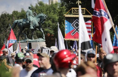 The statue of Robert E. Lee stands behind a crowd of hundreds of white nationalists, neo-Nazis, and members of the alt-right on August 12th, 2017, in Charlottesville, Virginia.