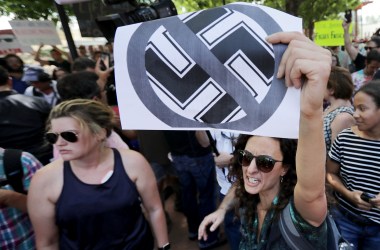 Protesters shout anti-Nazi chants after chasing alt-right blogger Jason Kessler from a news conference on August 13th, 2017, in Charlottesville, Virginia.