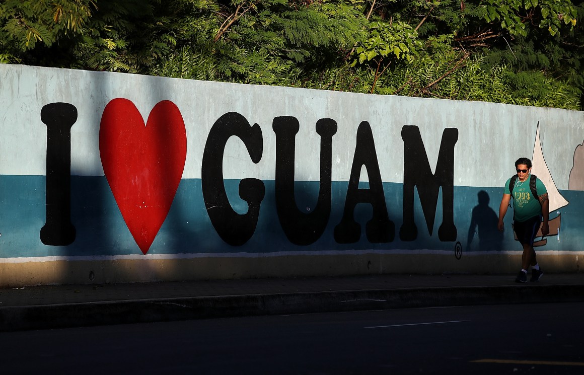 A pedestrian walks by a mural on August 14th, 2017, in Tamuning, Guam.