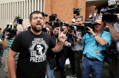 Matthew Heinbach (L) of the white nationalist Traditionalist Workers Party shouts at journalists gathered outside the Charlottesville General District Court building on August 14th, 2017, in Charlottesville, Virginia.