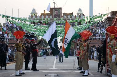 Pakistani Rangers (black) and Indian Border Security Force personnel (brown) perform during the daily beating of the retreat ceremony at the India-Pakistan Wagah Border Post, some 35kms west of Amritsar on August 14th, 2017. Pakistan celebrates its independence on August 14th, one day before India's independence day on August 15th.