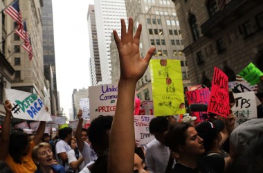 Dozens of immigration advocates attend a rally outside of Trump Tower on August 15th, 2017, in New York City.