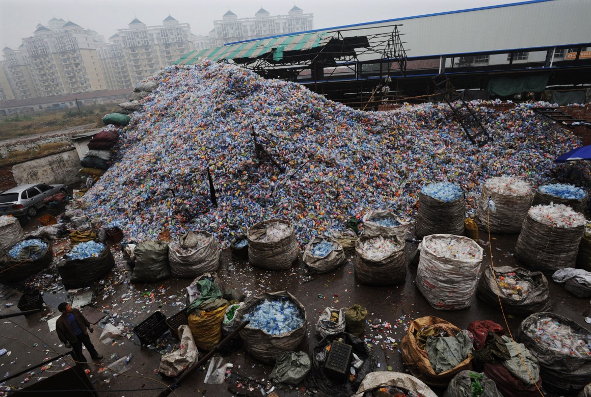 Used plastic bottles remain heaped up at a recycling mill in Wuhan of Hubei Province, China.