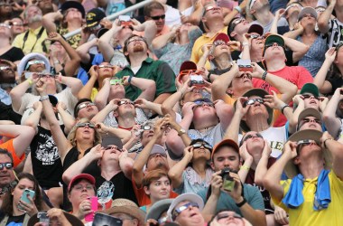 People watch the solar eclipse at Saluki Stadium on the campus of Southern Illinois University on August 21st, 2017, in Carbondale, Illinois. Although much of it was covered by a cloud, with approximately 2 minutes 40 seconds, the area in southern Illinois experienced the longest duration of totality during the eclipse.