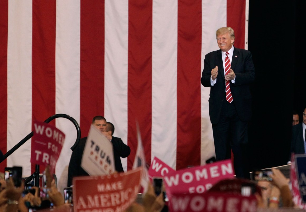 President Donald Trump applauds the crowd of supporters at the Phoenix Convention Center as he takes the stage during a rally on August 22nd, 2017, in Phoenix, Arizona.