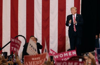 President Donald Trump applauds the crowd of supporters at the Phoenix Convention Center as he takes the stage during a rally on August 22nd, 2017, in Phoenix, Arizona.