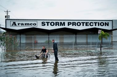 Brad Matheney offers help to a man in a wheelchair while Hurricane Harvey passes through Galveston, Texas, on August 26th, 2017.