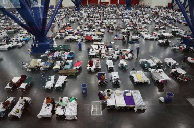 People take shelter at the George R. Brown Convention Center after floodwaters from Hurricane Harvey inundated the city on August 29th, 2017, in Houston, Texas. The evacuation center, which is overcapacity, has already received more than 9,000 evacuees, with more arriving.