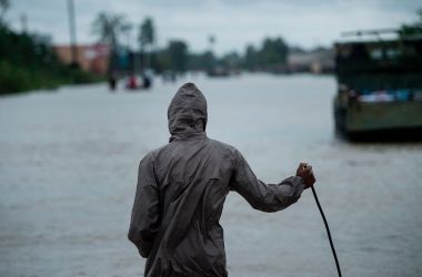 A man looks out on a flooded road during the aftermath of Hurricane Harvey on August 29th, 2017, in Houston, Texas.