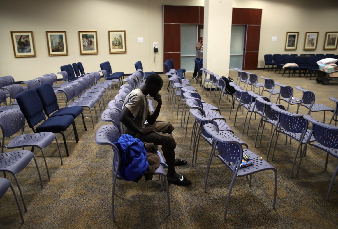 A young man waits to be processed into the temporary shelter located at the Lakewood Church on August 29th, 2017, in Houston, Texas.